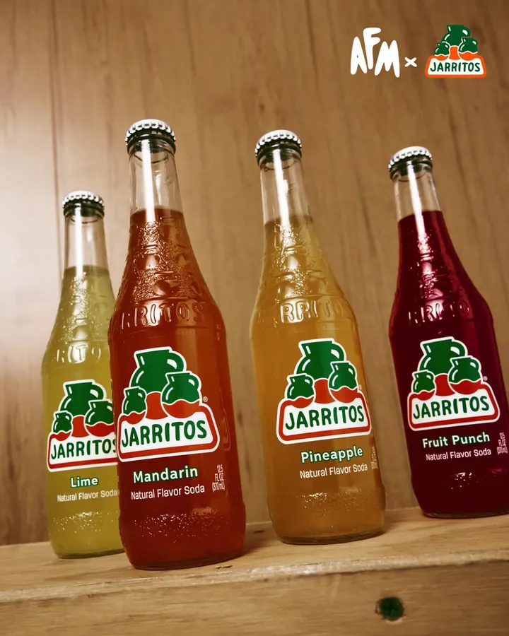 Jarritos × Action Figure Miles: four Jarritos bottles on a wooden shelf